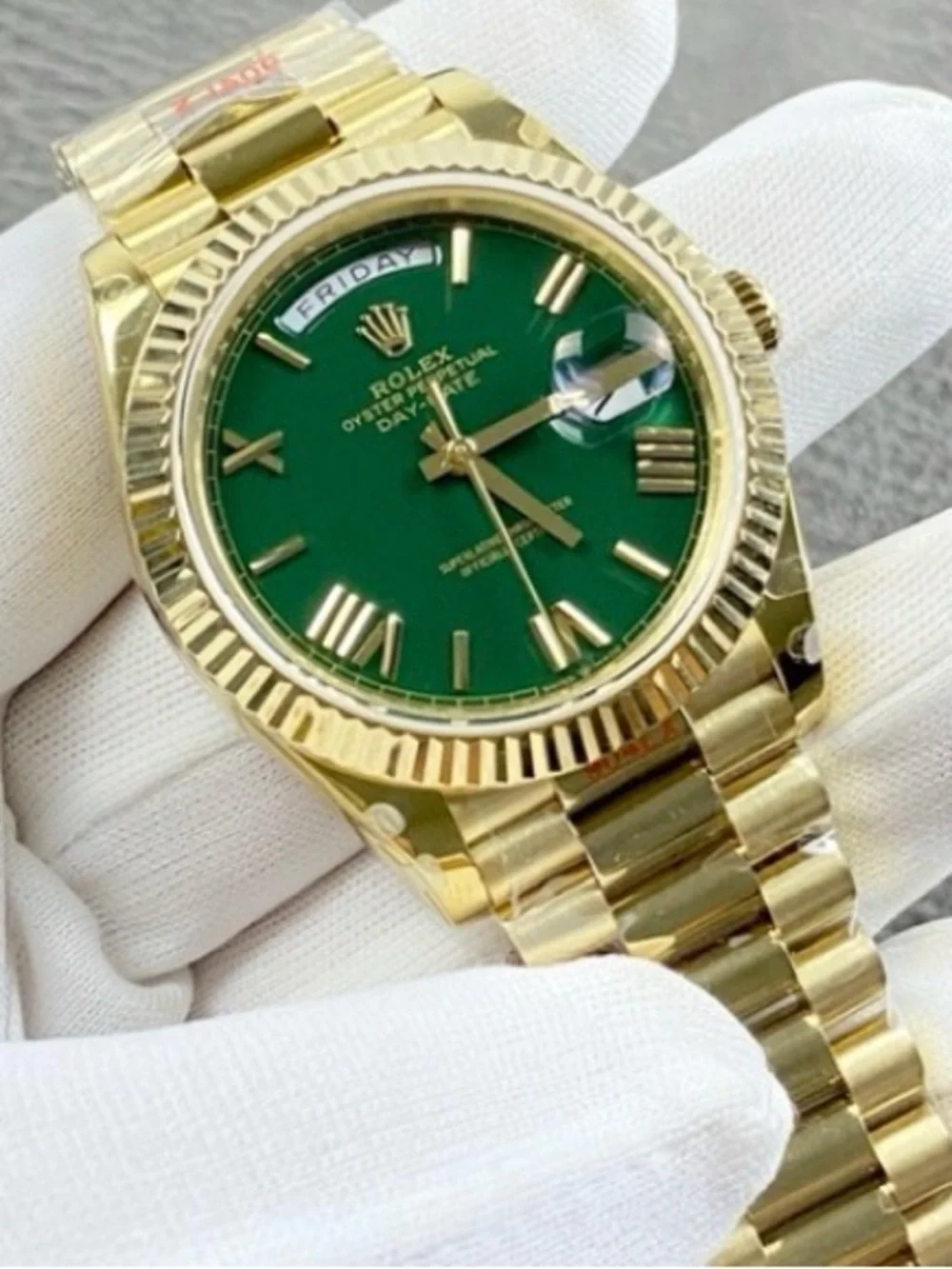 Rolex Day-Date 40 Green Roman Yellow Gold
